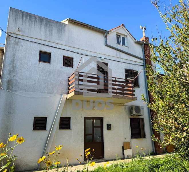 An old stone house in the center of Betina, right next to the sea